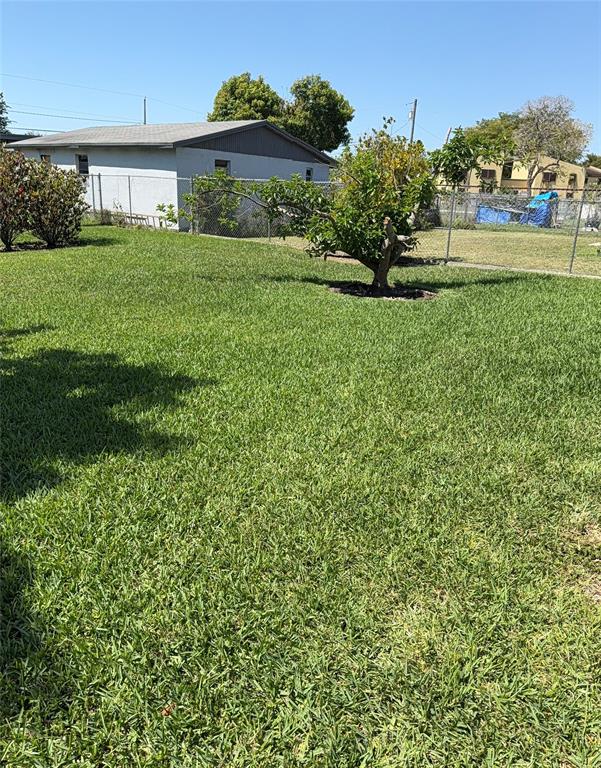 10262 Southwest 179th Street Miami, FL 33157 - Photo 25 of 26 a front view of a house with garden
