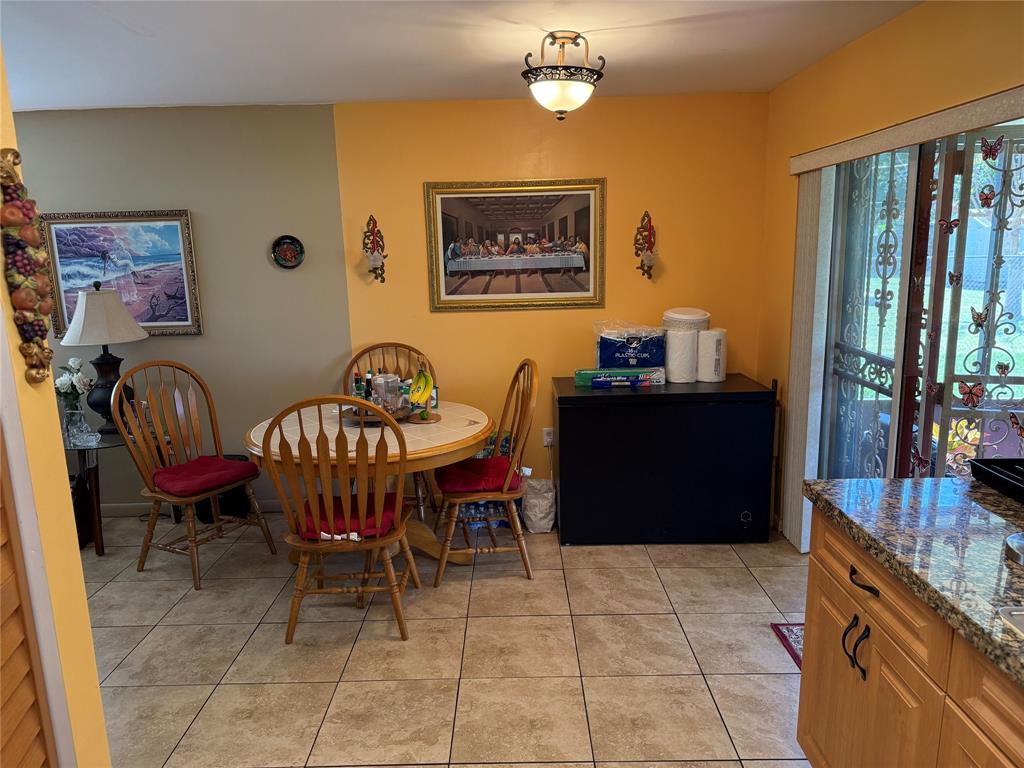 10262 Southwest 179th Street Miami, FL 33157 - Photo 5 of 26 a dining room with furniture and window