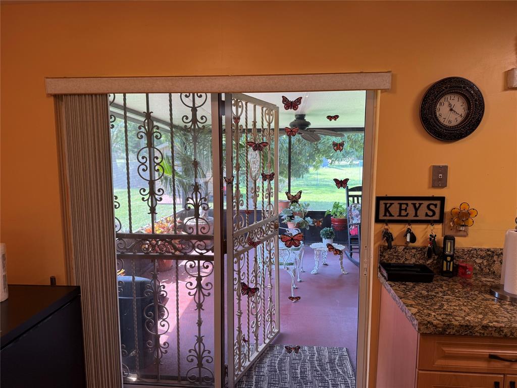 10262 Southwest 179th Street Miami, FL 33157 - Photo 6 of 26 a view of a chairs and table in a living room