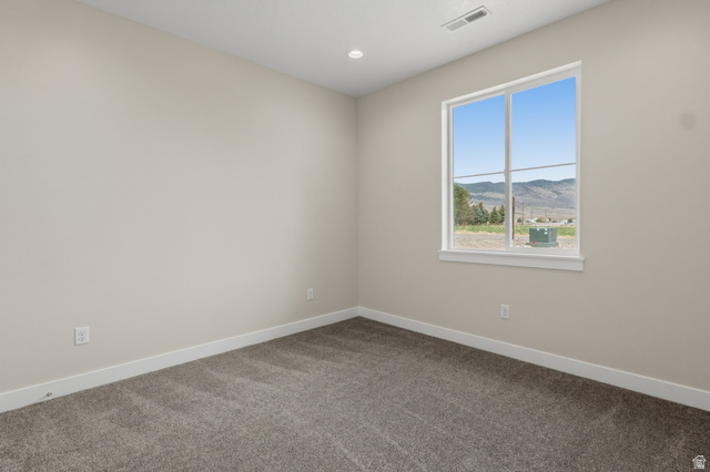 169 West 100 South Joseph, UT 84739 - Photo 25 of 35 Empty room with a mountain view, carpet, and recessed lighting