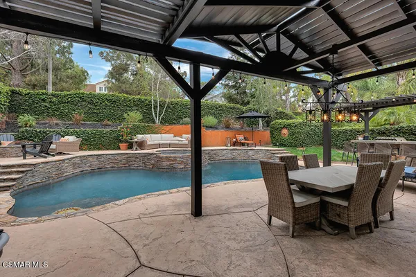 a view of a swimming pool with a patio