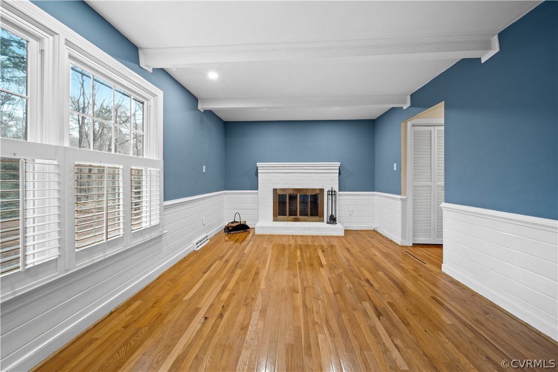 2331 Hicks Road Richmond, VA 23235 - Photo 13 of 38 Wood-burning fireplace and hardwood floors complem