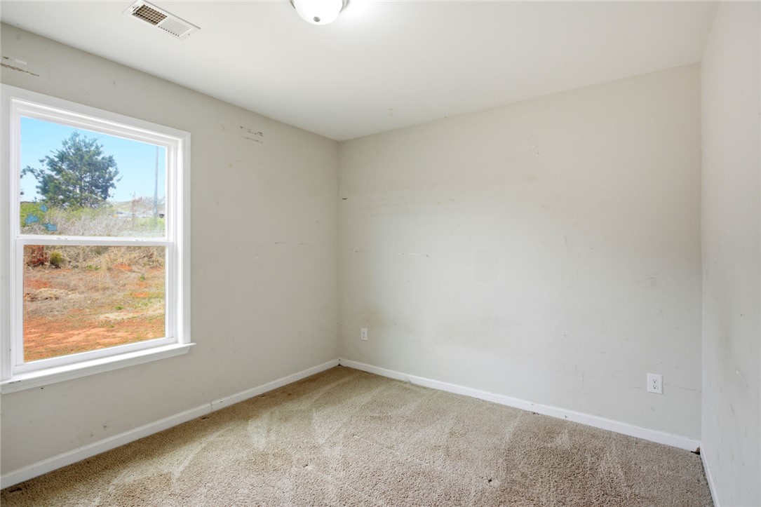 245 Maple Grove Road Seneca, SC 29678 - Photo 24 of 40 This spacious room provides a blank canvas, ready for your personal touch and design vision.
