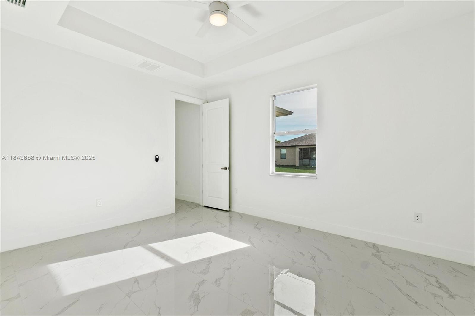 2516 Park Road, Unit 2516 Lehigh Acres, FL 33971 - Photo 8 of 13 an empty room with windows