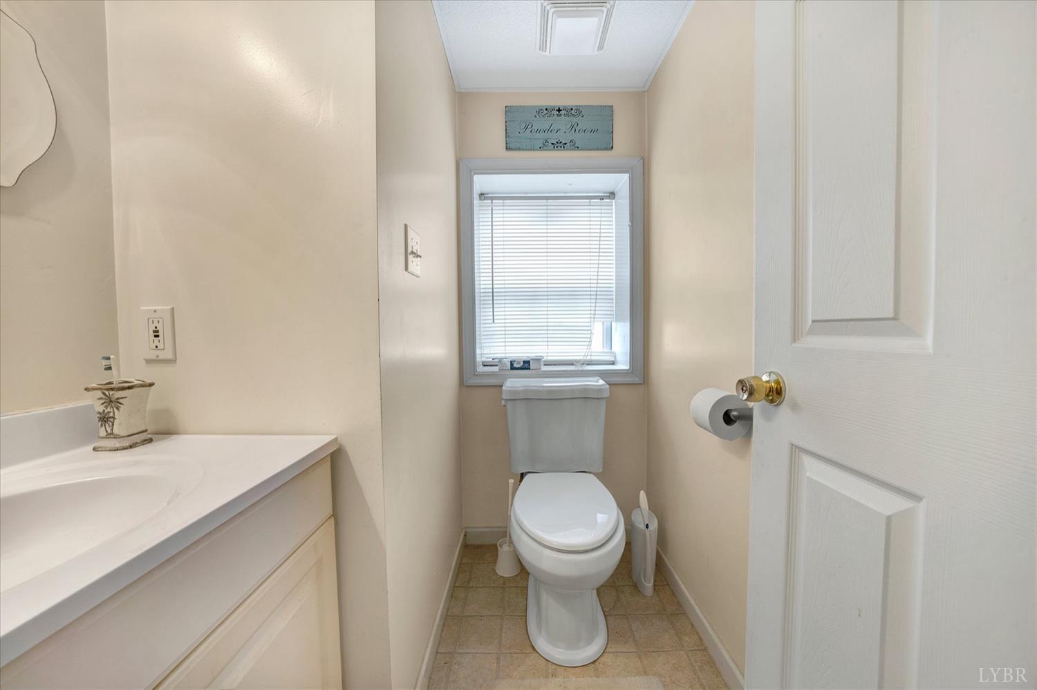 1408 Woodridge Road Blue Ridge, VA 24064 - Photo 26 of 39 a bathroom with a sink a toilet and shower