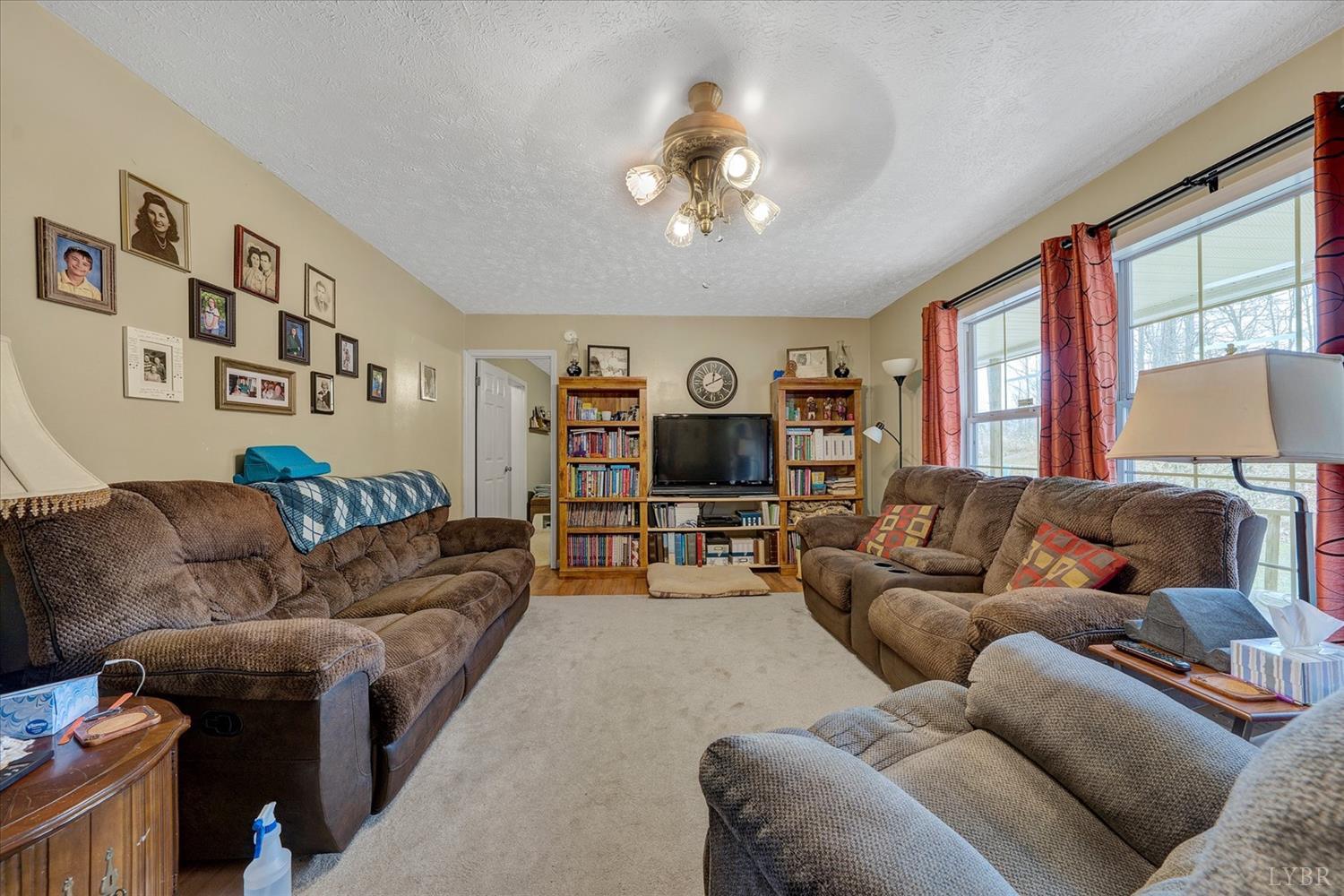 1408 Woodridge Road Blue Ridge, VA 24064 - Photo 7 of 39 a living room with furniture and a large window