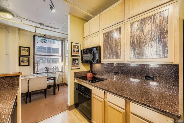 a kitchen with a sink and a refrigerator