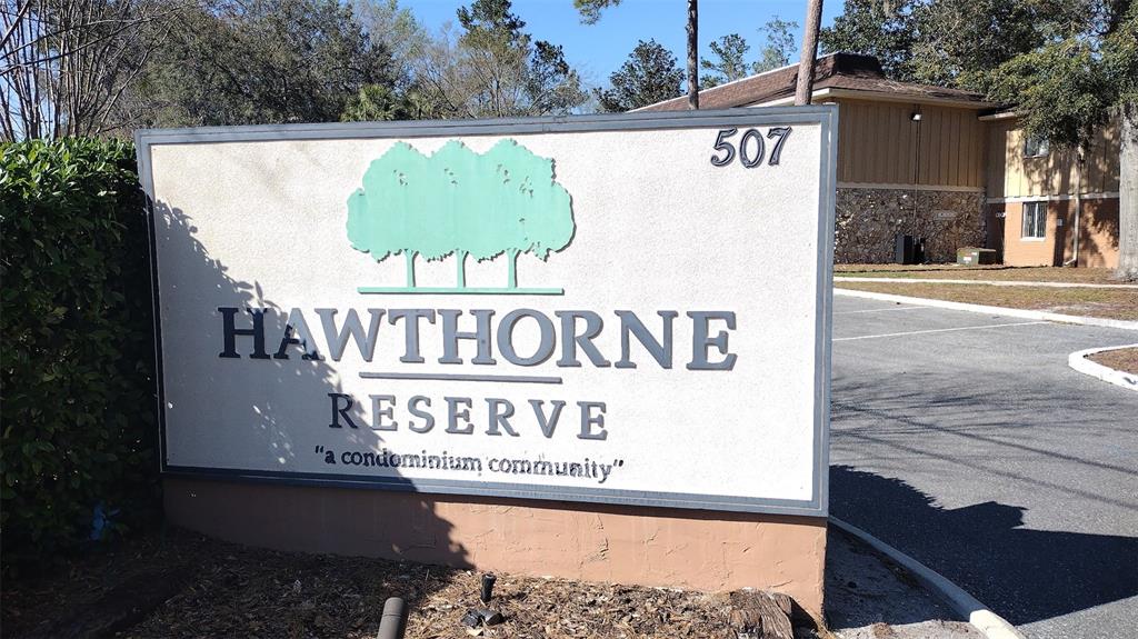 a view of outdoor space with signage and flags