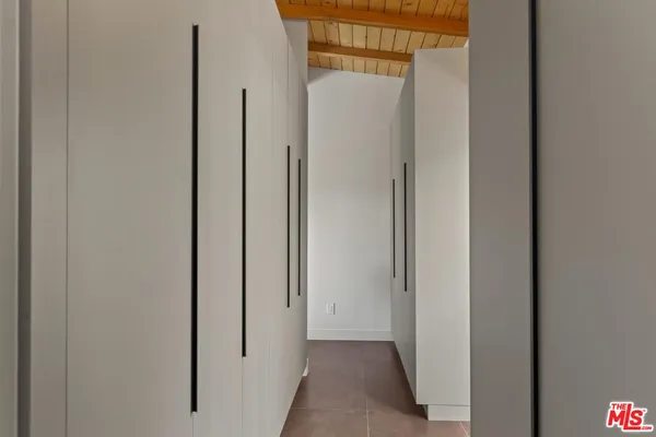 a bathroom with a sink vanity and a mirror