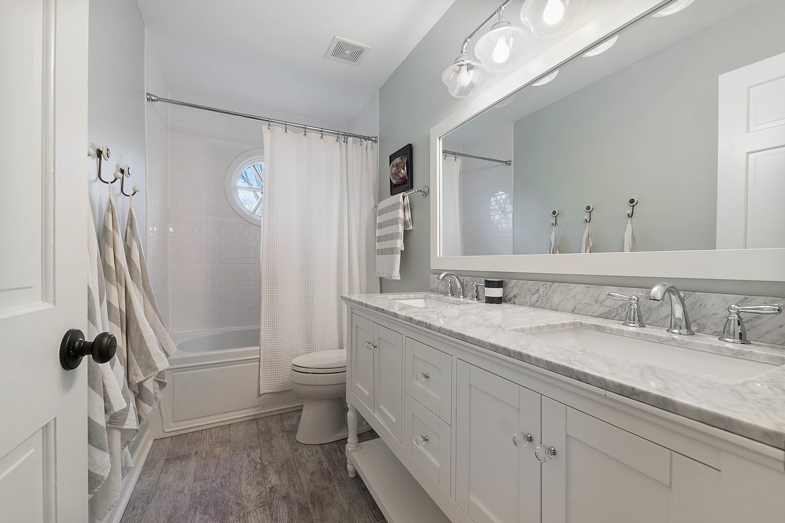 675 East Gartner Road Naperville, IL 60540 - Photo 27 of 31 a bathroom with a granite countertop sink a toilet a mirror and shower