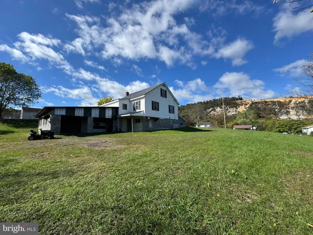 a view of a house with a big yard