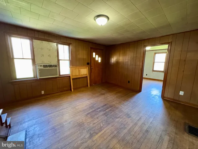 a large kitchen with a stove a sink dishwasher a refrigerator and a stove