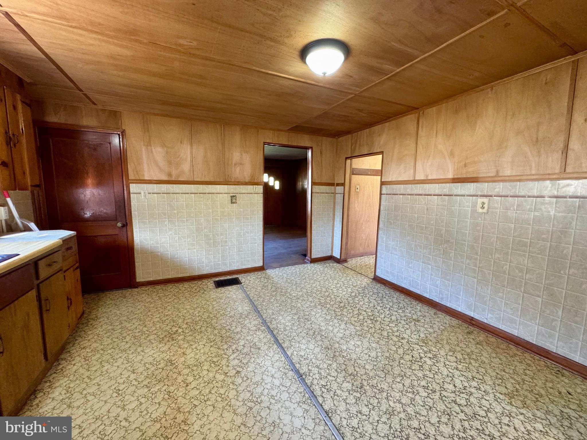 830 Harrison Avenue Berkeley Springs, WV 25411 - Photo 18 of 41 a view of a refrigerator in kitchen and utility room