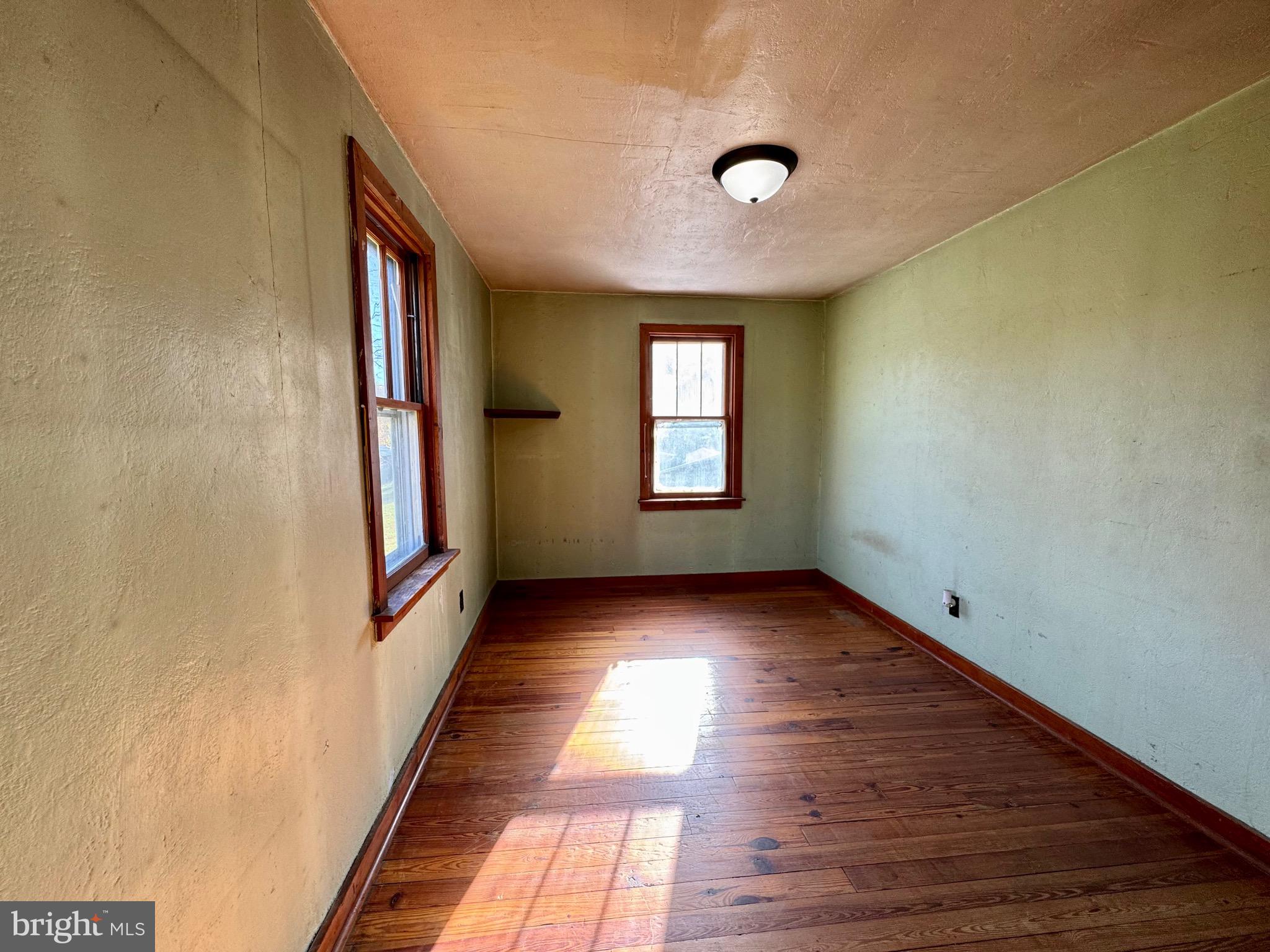 830 Harrison Avenue Berkeley Springs, WV 25411 - Photo 21 of 41 a view of an empty room and window