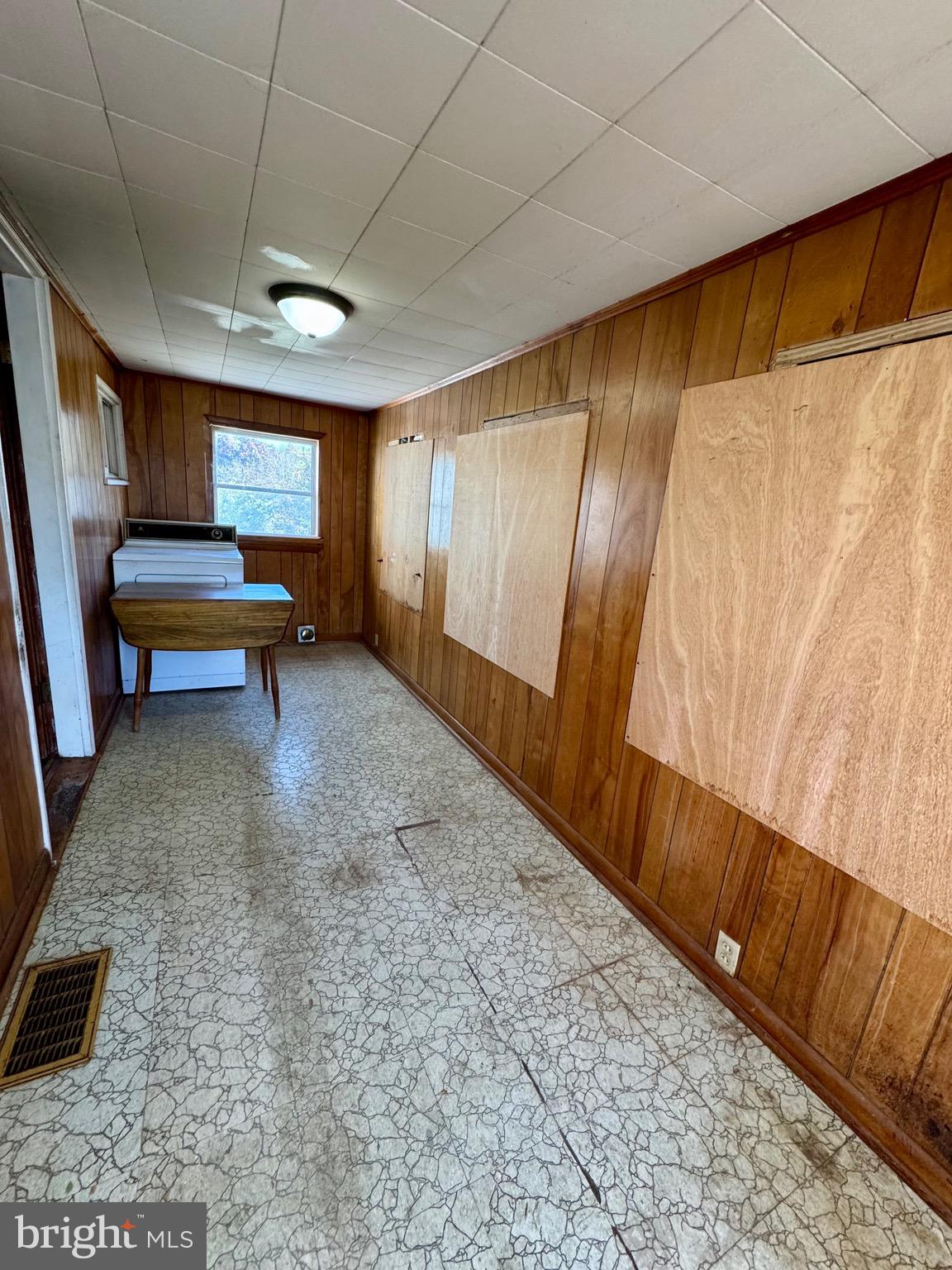 830 Harrison Avenue Berkeley Springs, WV 25411 - Photo 23 of 41 a view of a room with wooden floor and furniture