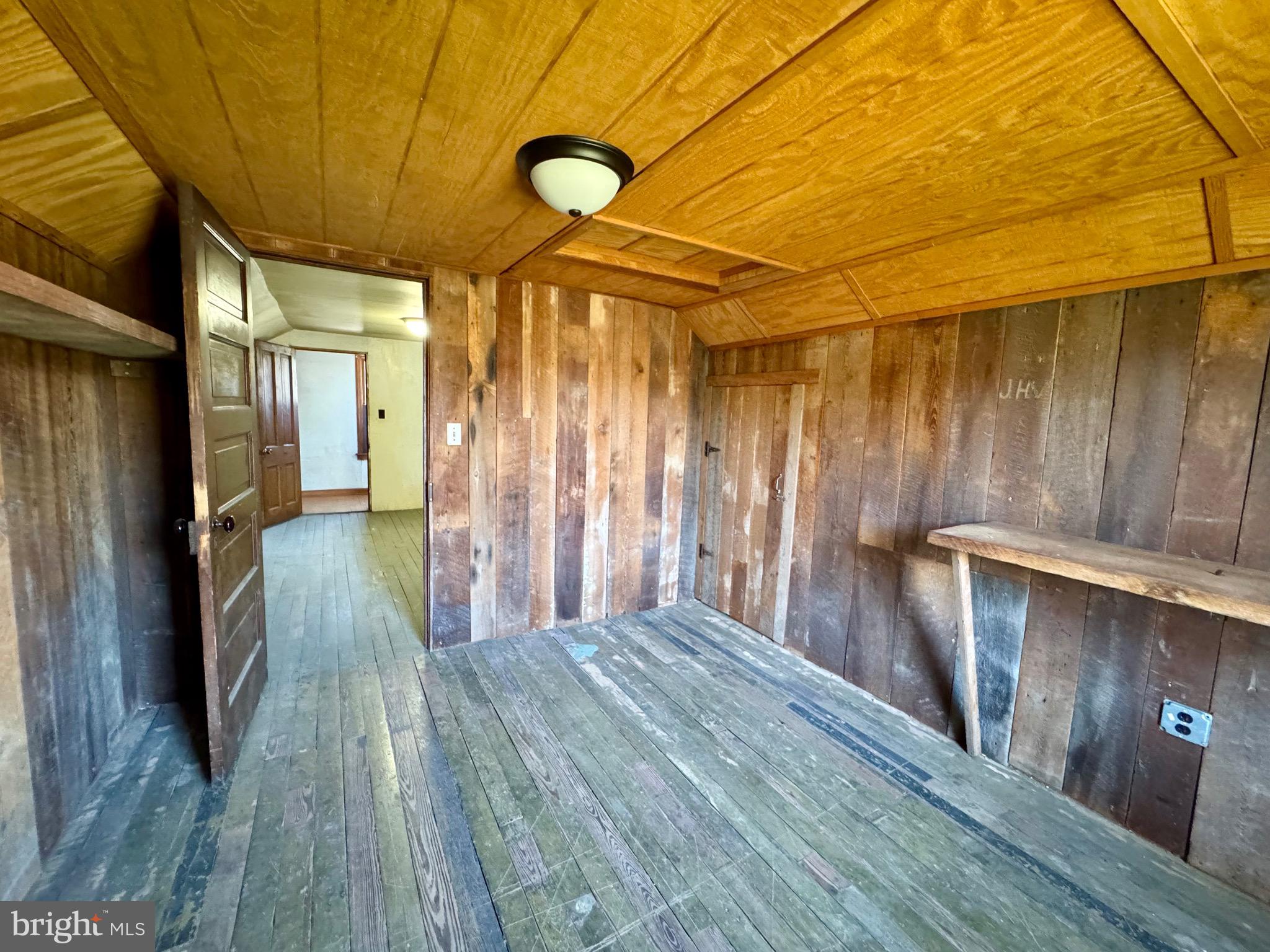830 Harrison Avenue Berkeley Springs, WV 25411 - Photo 29 of 41 a view of a hallway with wooden floor