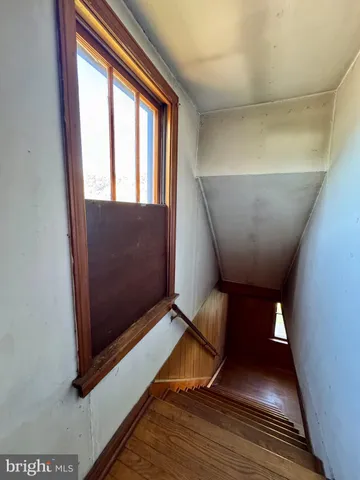 a view of empty room with a fireplace