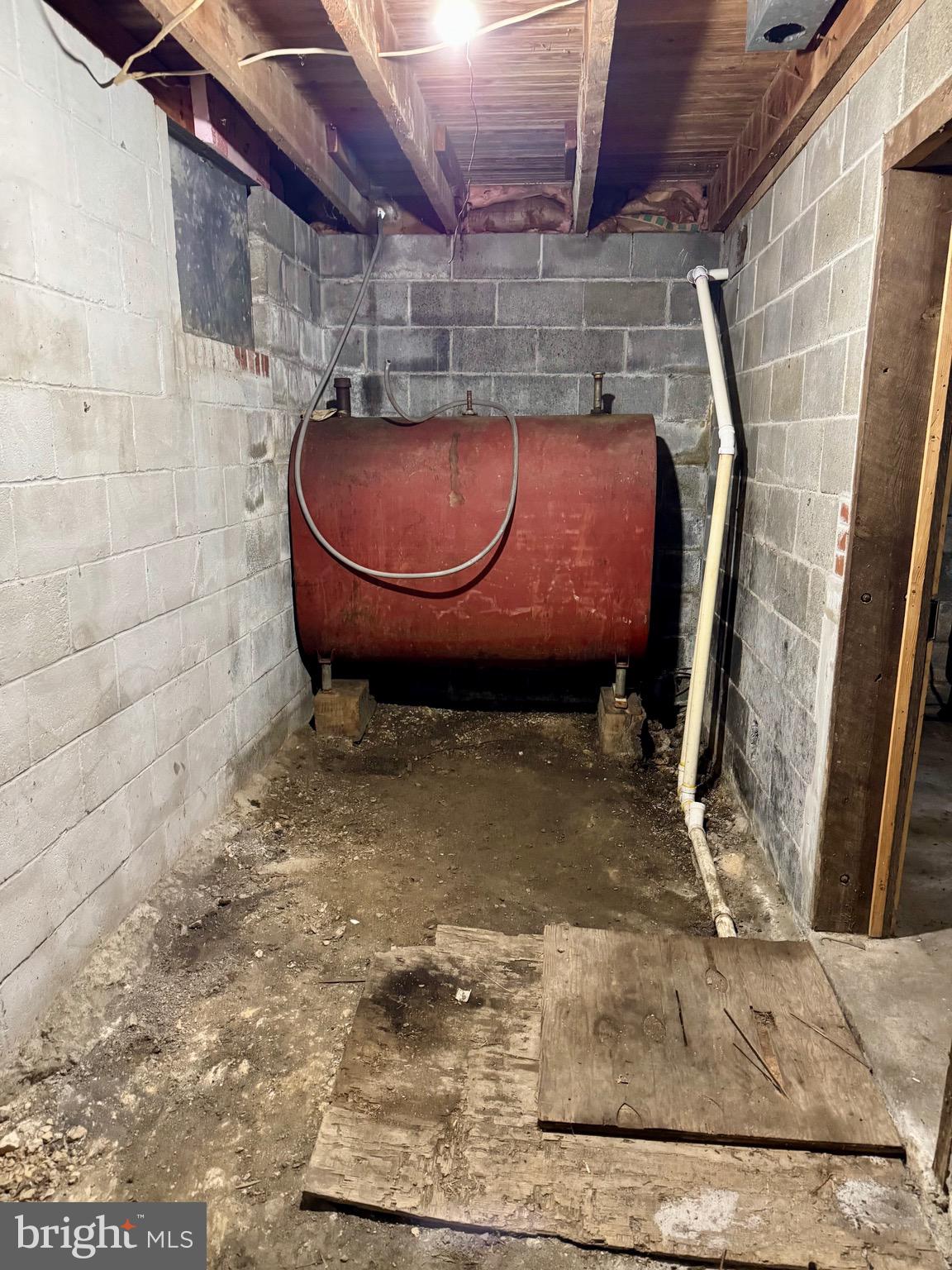 830 Harrison Avenue Berkeley Springs, WV 25411 - Photo 38 of 41 a room with water heater and a wooden door