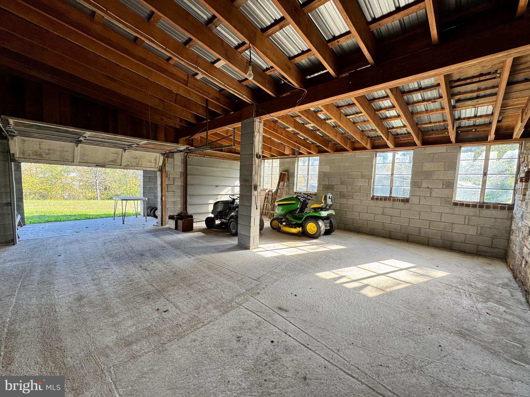 830 Harrison Avenue Berkeley Springs, WV 25411 - Photo 40 of 41 a view of parking garage with cars