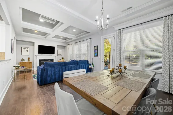 a view of a livingroom with furniture window and wooden floor