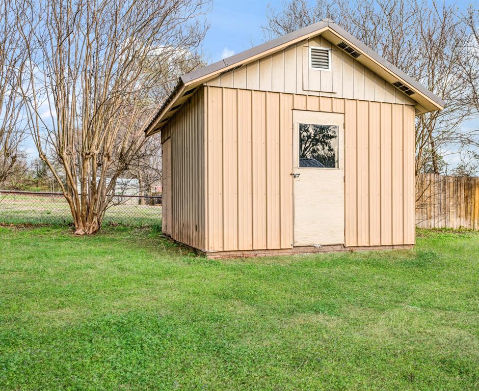 970 Mansfield Road Reno, TX 75462 - Photo 15 of 20 a view of backyard of house