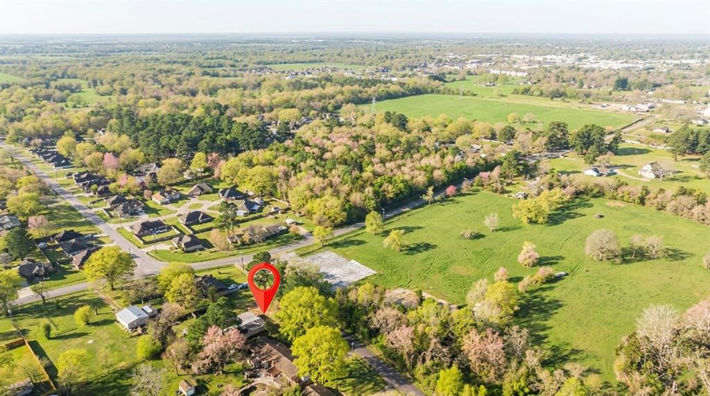 970 Mansfield Road Reno, TX 75462 - Photo 19 of 20 an aerial view of residential houses with outdoor space and trees
