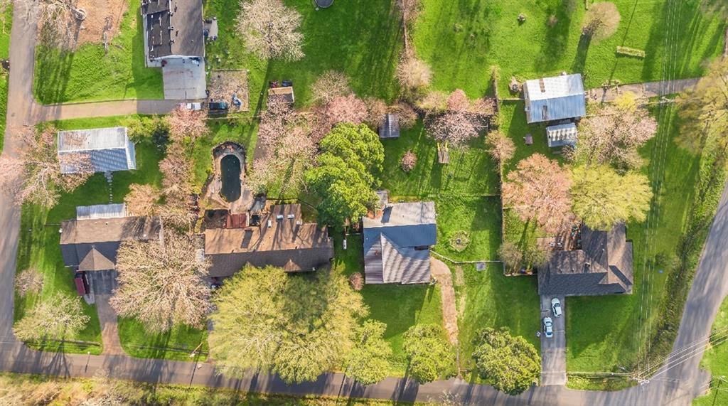 970 Mansfield Road Reno, TX 75462 - Photo 20 of 20 aerial view of a house with a yard and large trees