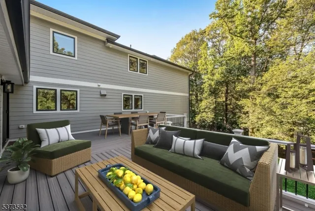 a view of sitting area with furniture and wooden floor