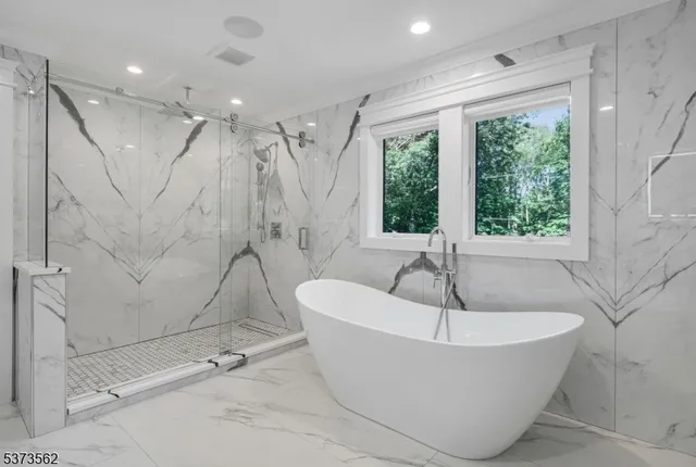 a bathroom with a sink vanity and mirror