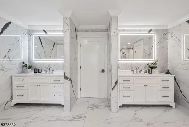 a bedroom with a bed and glass window