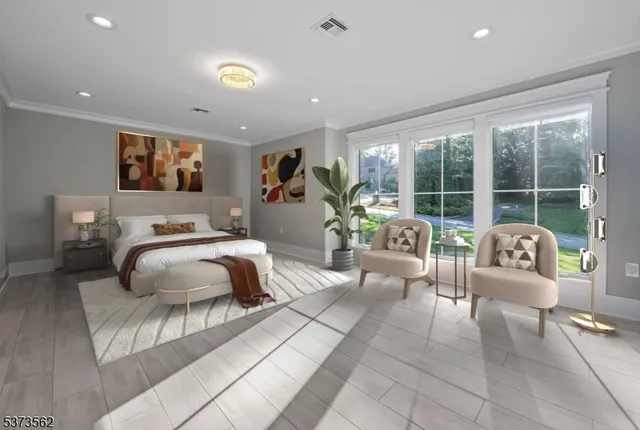 a bathroom with a double vanity sink a large mirror and a bathtub