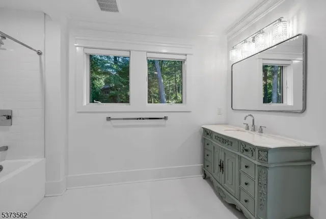 a spacious bedroom with a large bed and a couch