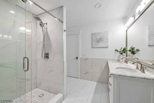 a kitchen with a sink cabinets and a washer dryer