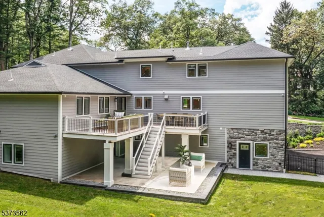 a view of a living room with a table and chairs