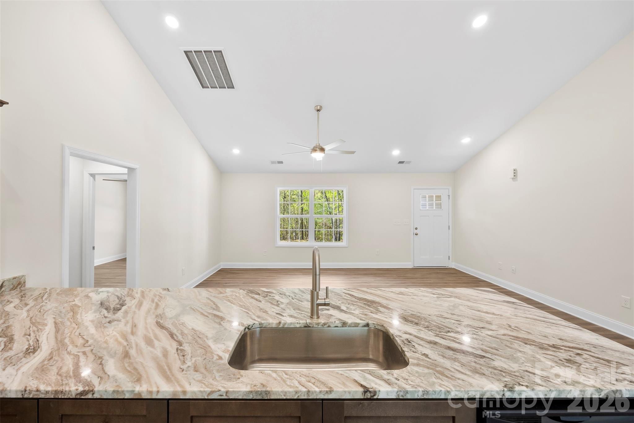 872 Roxboro Drive Mount Gilead, NC 27306 - Photo 12 of 41 a view of a kitchen with a sink and window