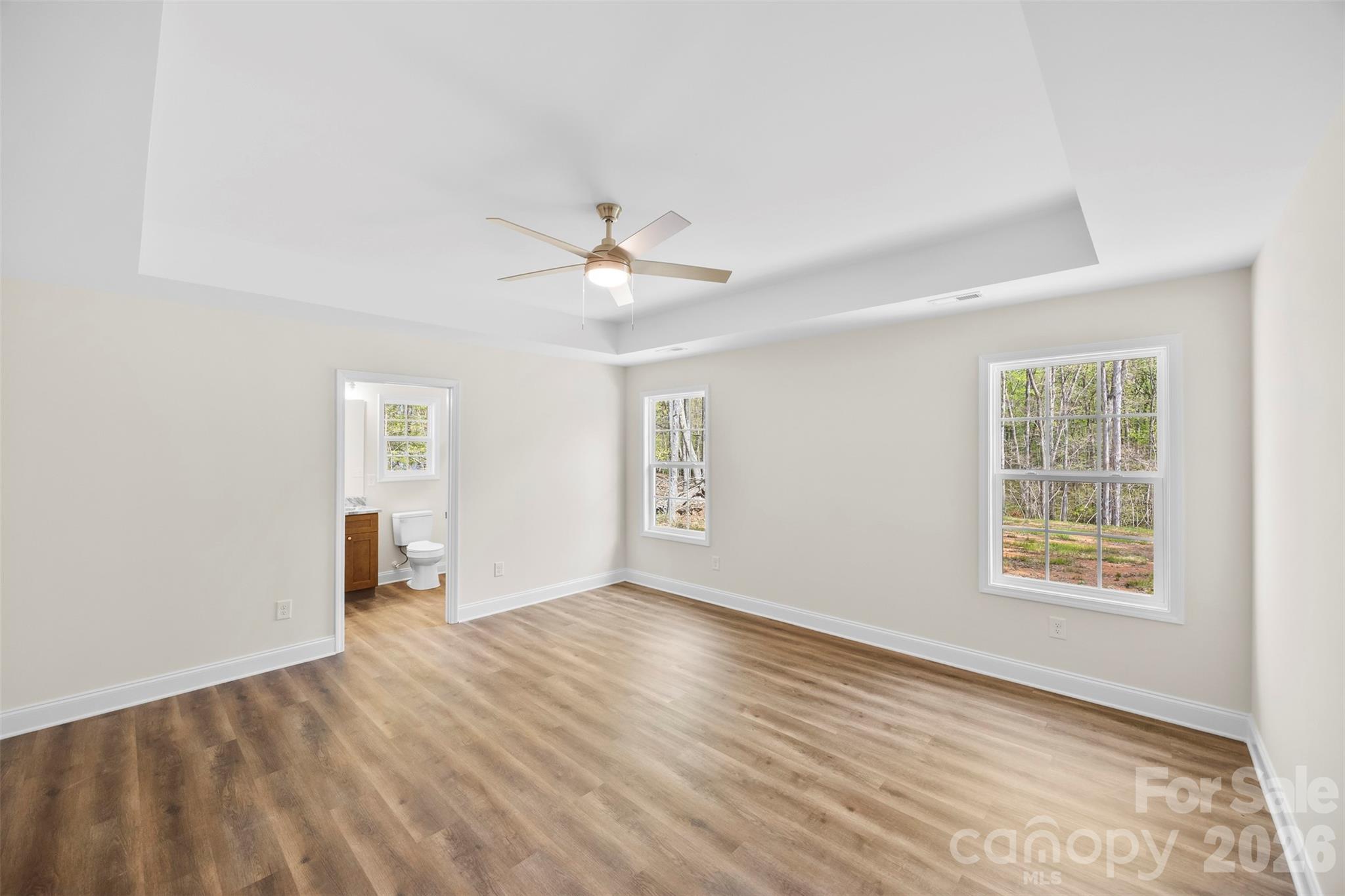 872 Roxboro Drive Mount Gilead, NC 27306 - Photo 13 of 41 wooden floor in an empty room with a window