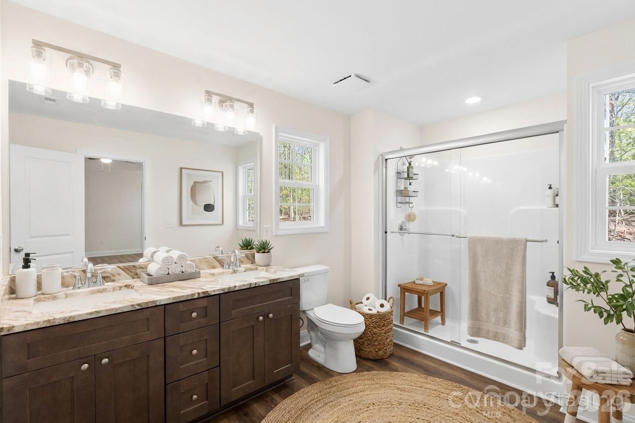 872 Roxboro Drive Mount Gilead, NC 27306 - Photo 16 of 41 a spacious bathroom with a double vanity sink mirror and toilet
