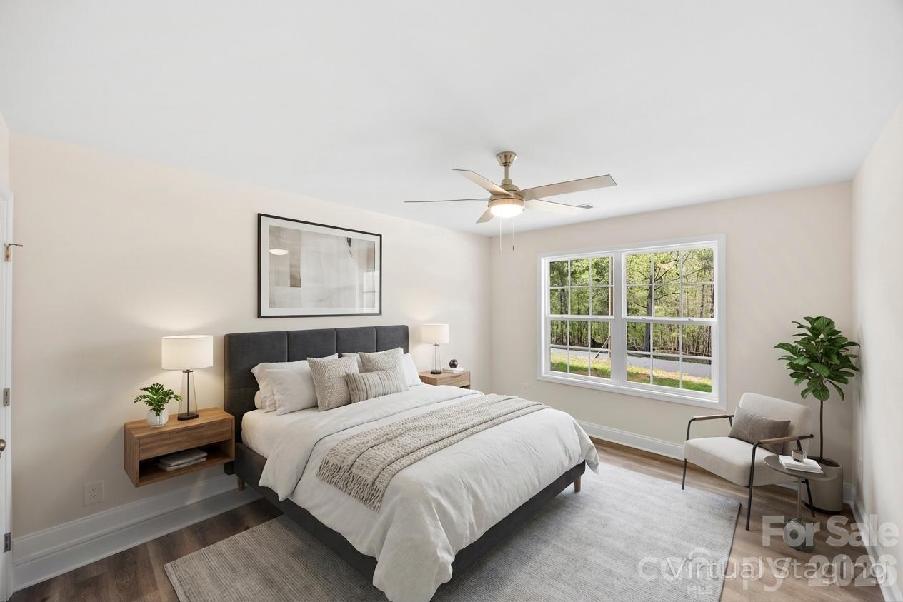 872 Roxboro Drive Mount Gilead, NC 27306 - Photo 20 of 41 a bedroom with a bed and a couch