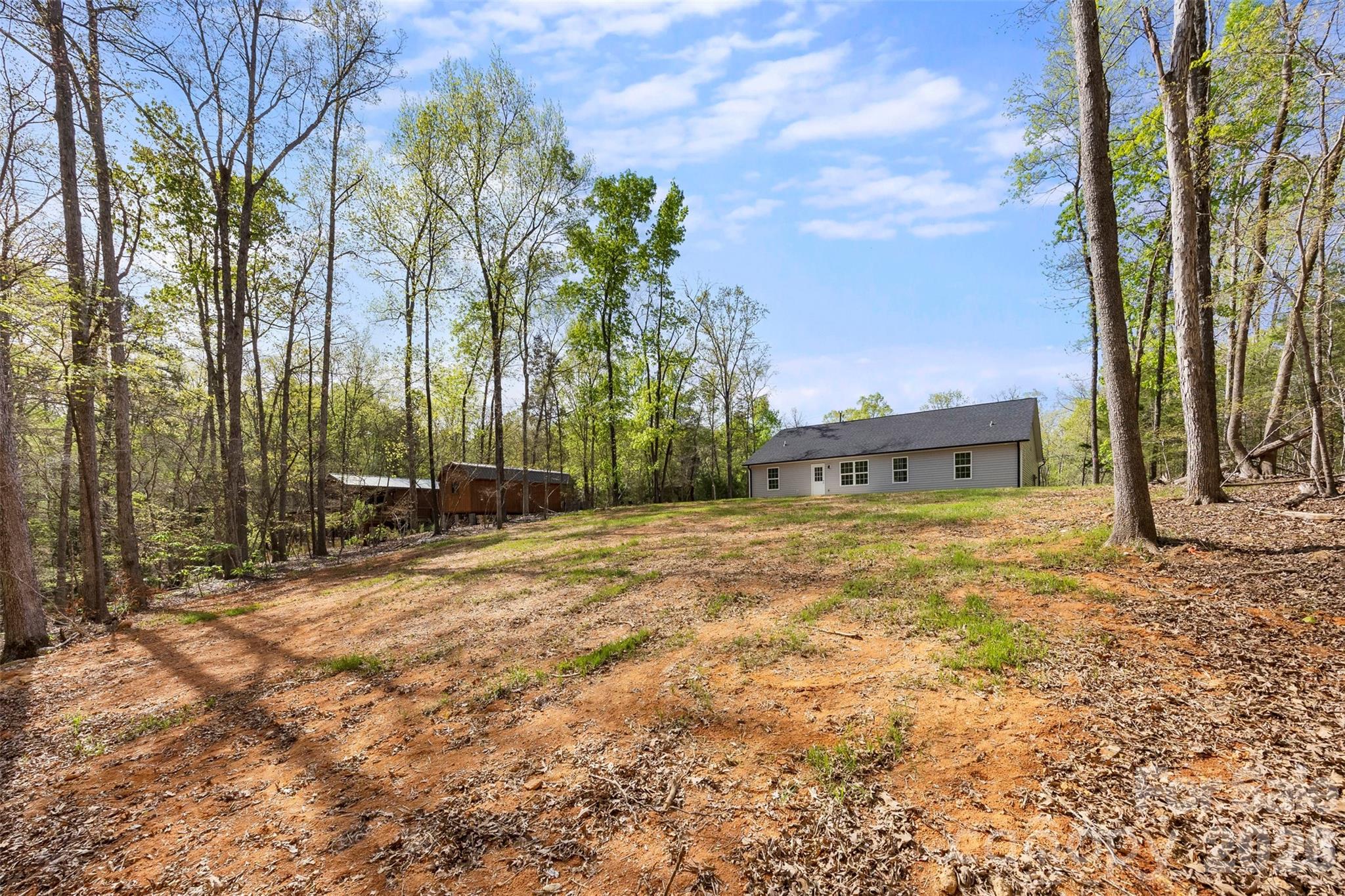 872 Roxboro Drive Mount Gilead, NC 27306 - Photo 29 of 41 a backyard of a house with lots of green space