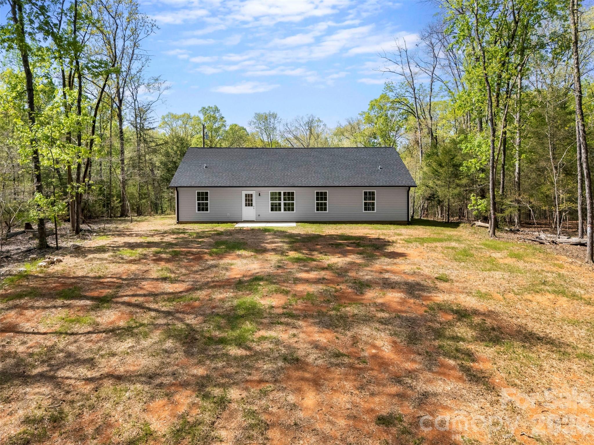 872 Roxboro Drive Mount Gilead, NC 27306 - Photo 30 of 41 a front view of a house with a yard