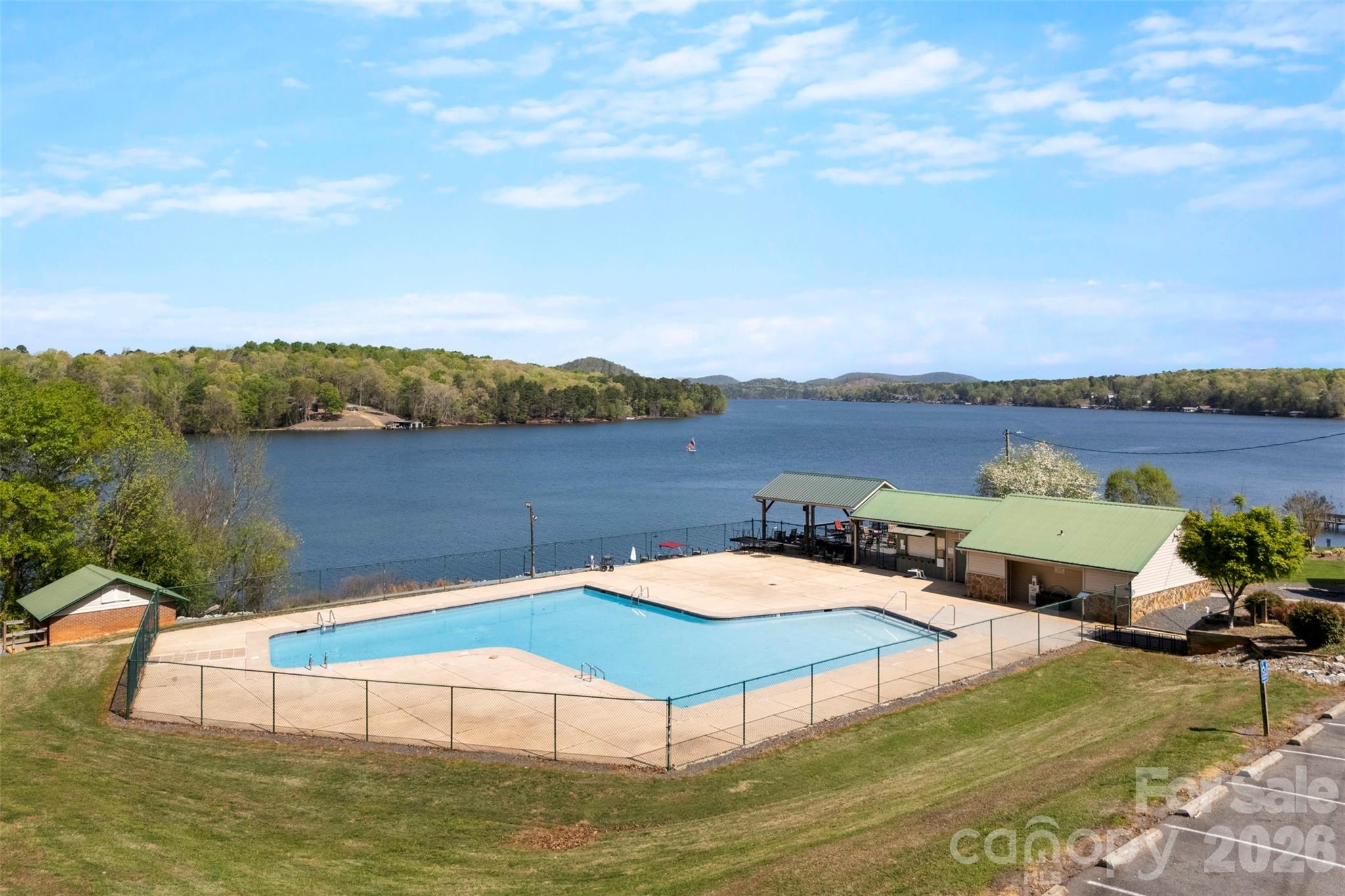 872 Roxboro Drive Mount Gilead, NC 27306 - Photo 4 of 41 a view of a lake with a mountain