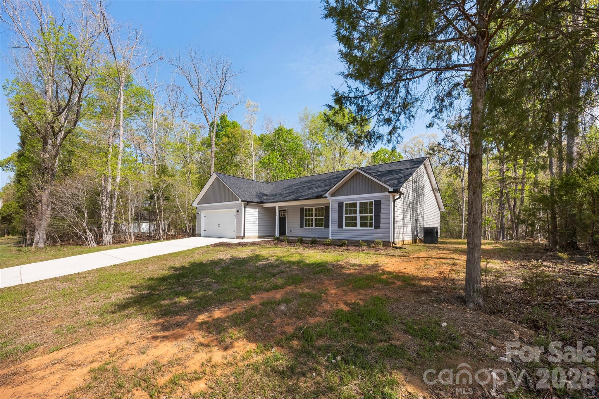 872 Roxboro Drive Mount Gilead, NC 27306 - Photo 41 of 41 a front view of a house with a yard and garage