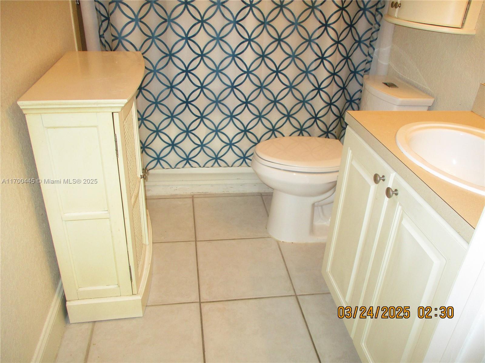 4802 Washington Street, Unit 2 Hollywood, FL 33021 - Photo 19 of 24 a bathroom with a sink and a toilet