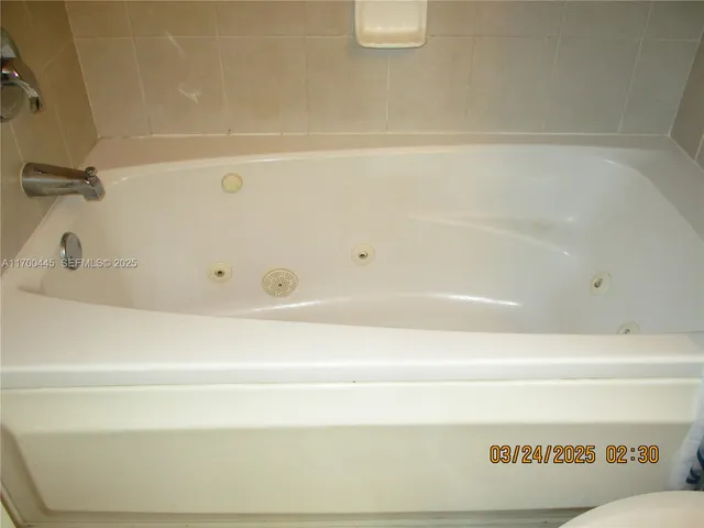 a close view of a bathtub in a bathroom