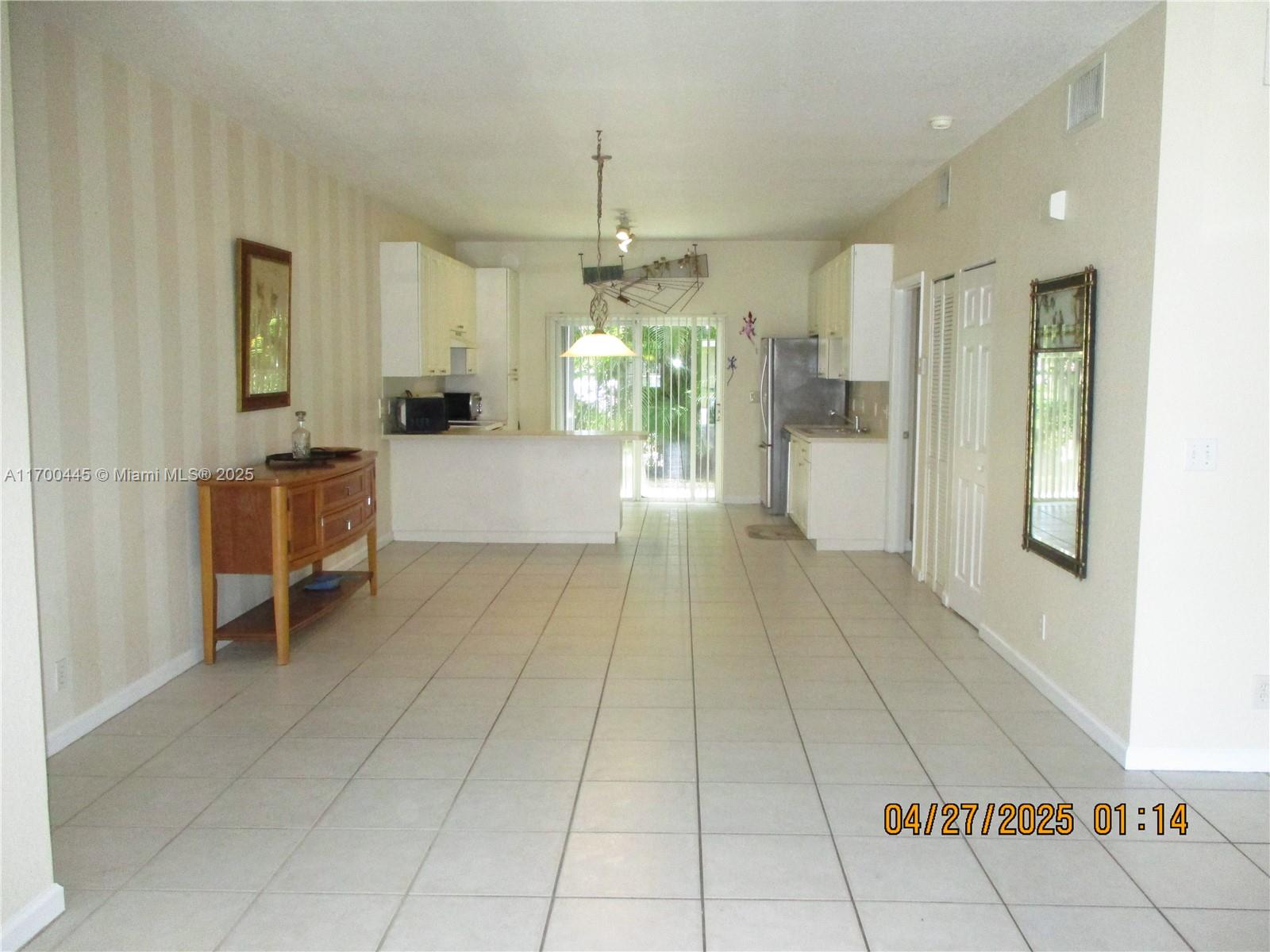 4802 Washington Street, Unit 2 Hollywood, FL 33021 - Photo 24 of 24 a view of a kitchen with kitchen island granite countertop lots of counter top space and cabinets