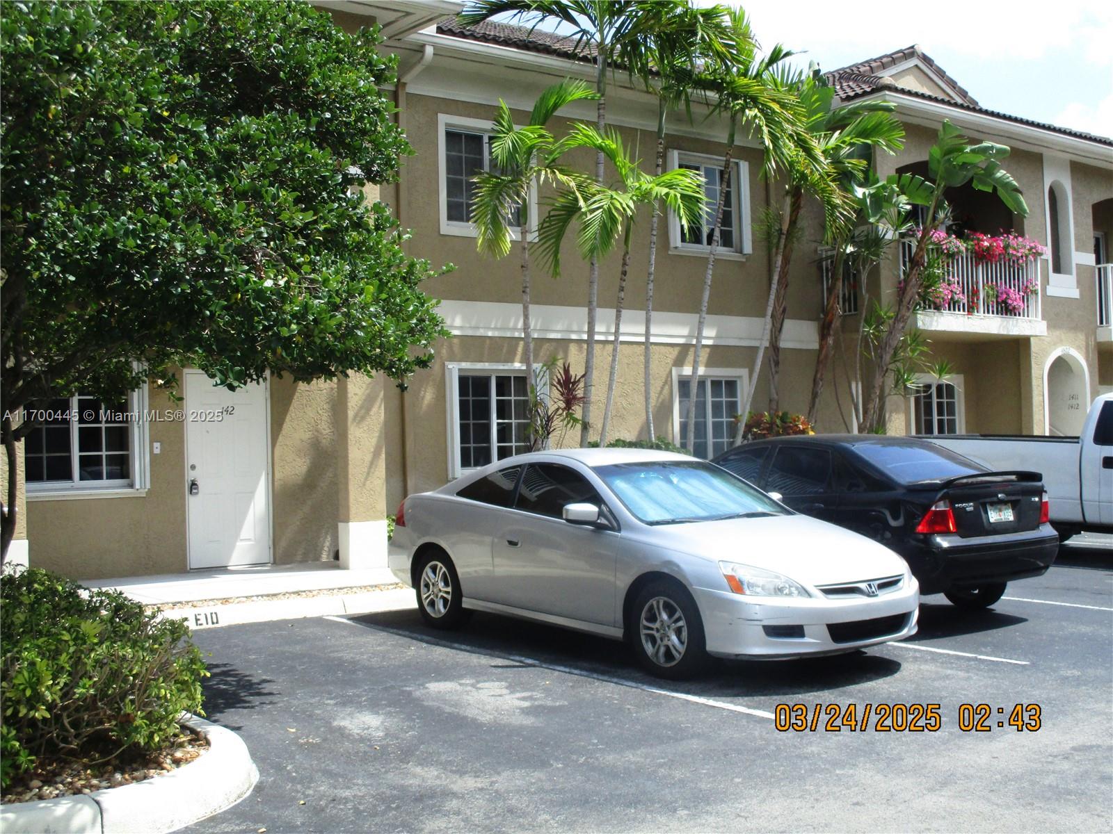 4802 Washington Street, Unit 2 Hollywood, FL 33021 - Photo 4 of 24 a view of a cars park in front of a building