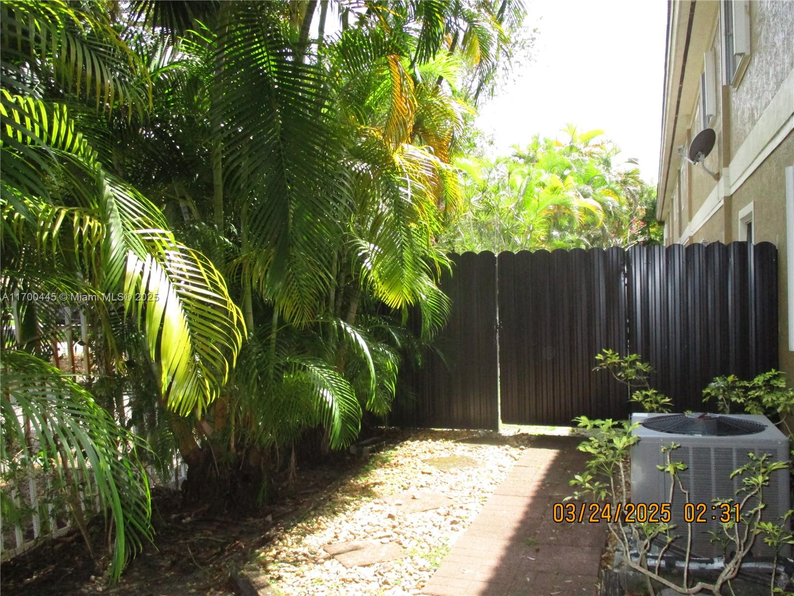 4802 Washington Street, Unit 2 Hollywood, FL 33021 - Photo 7 of 24 a view of a backyard with plants