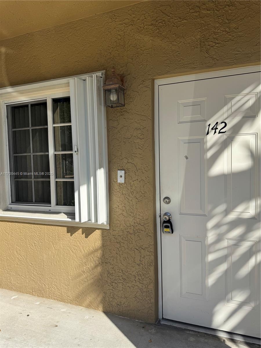 4802 Washington Street, Unit 2 Hollywood, FL 33021 - Photo 9 of 24 a view of a door and a window