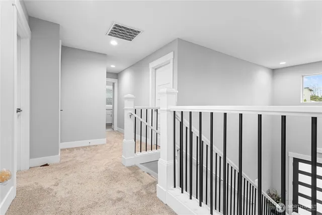 a view of a hallway with entryway door