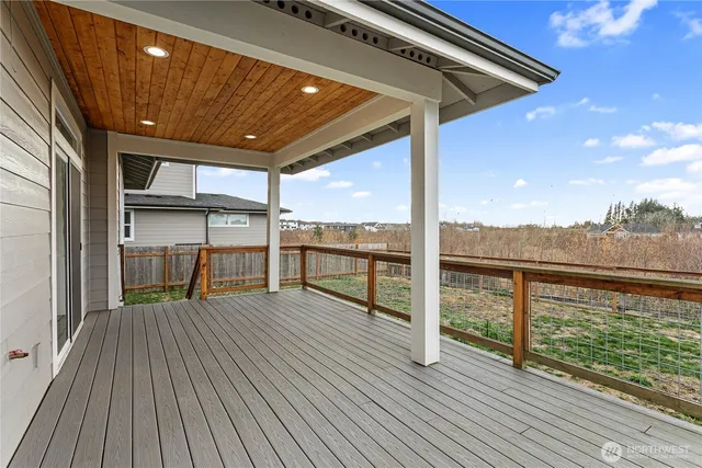 a view of a balcony with wooden floor